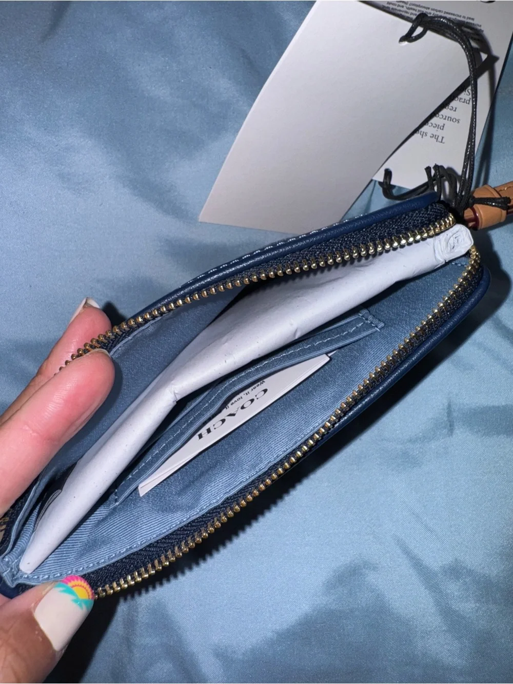 Coach Signature Denim Wristlet in Navy with Brown Leather Strap and cherry charm